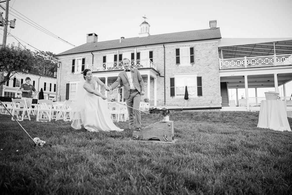 A black and white panoramic view of historic military barracks and laundry hanging on clotheslines at Fort Worden.