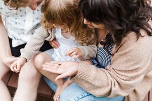 Intimate family portrait session showing tender moments and embraces.
