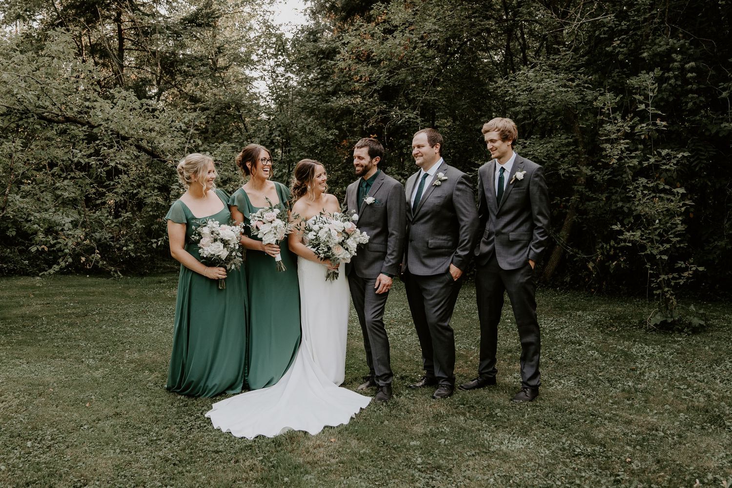 wedding party looking at bride and groom in Formosa, Ontario