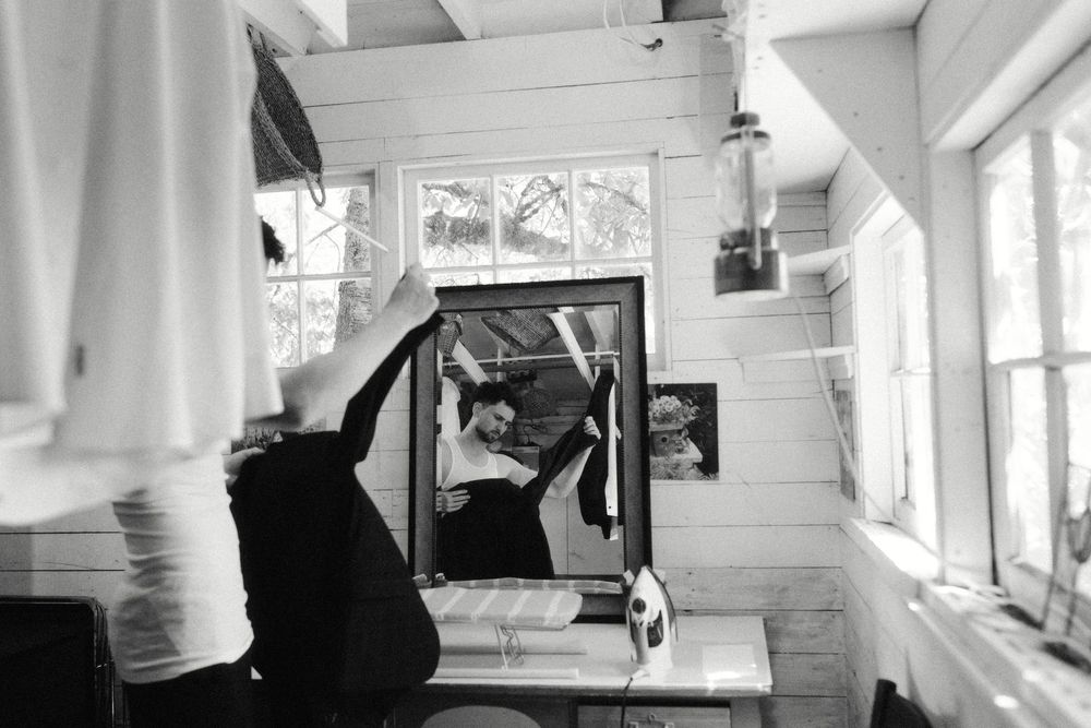 Black and white photos of a couple dancing in an indoor space.