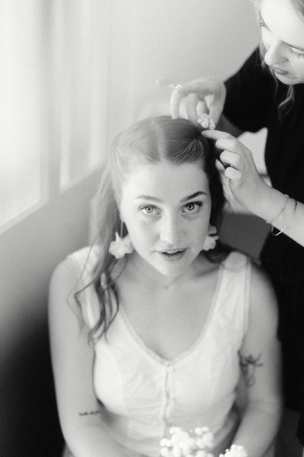 Vintage-style black and white portraits during wedding preparation.
