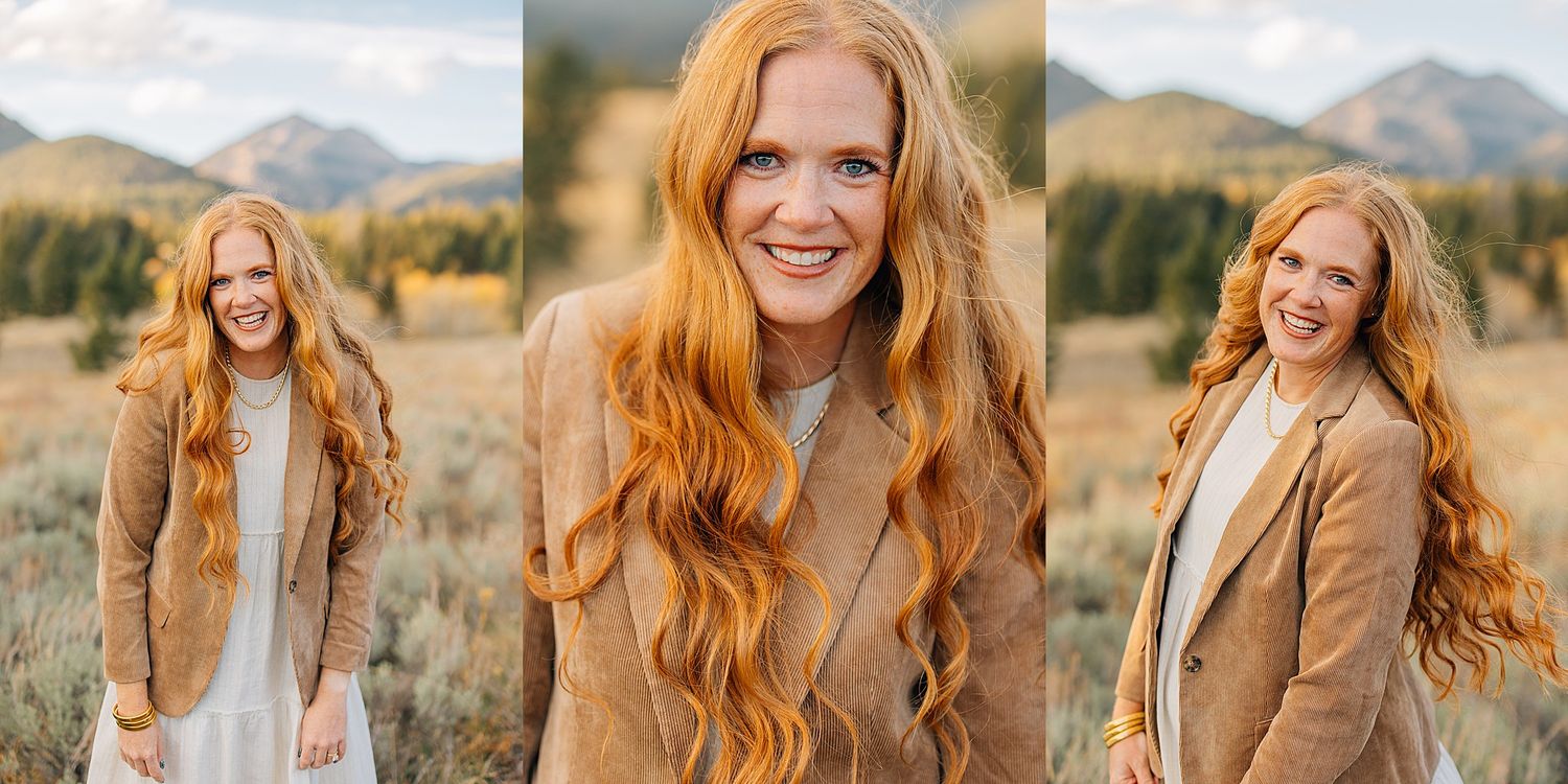 Women with red hair posing together in rustic outdoor setting with mountain landscape backdrop.