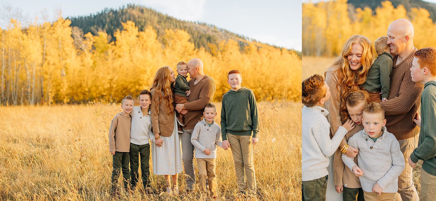 Family wearing coordinated neutral outfits poses together in golden autumn field during sunset.