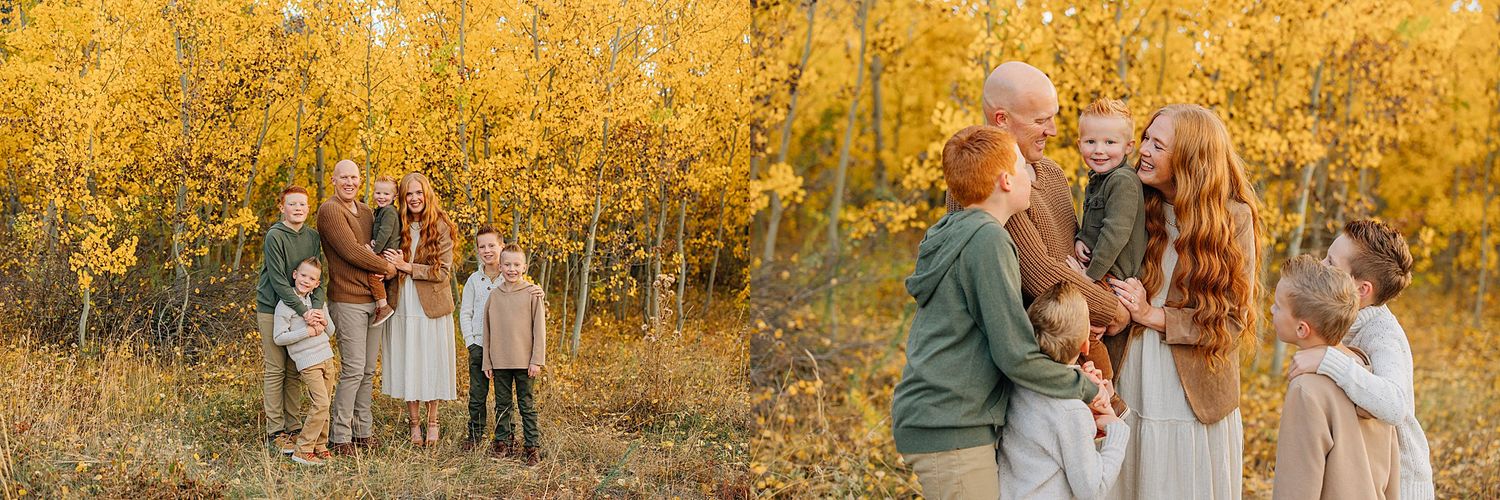 Family enjoying a golden autumn photoshoot in a grove of yellow aspen trees during fall season.