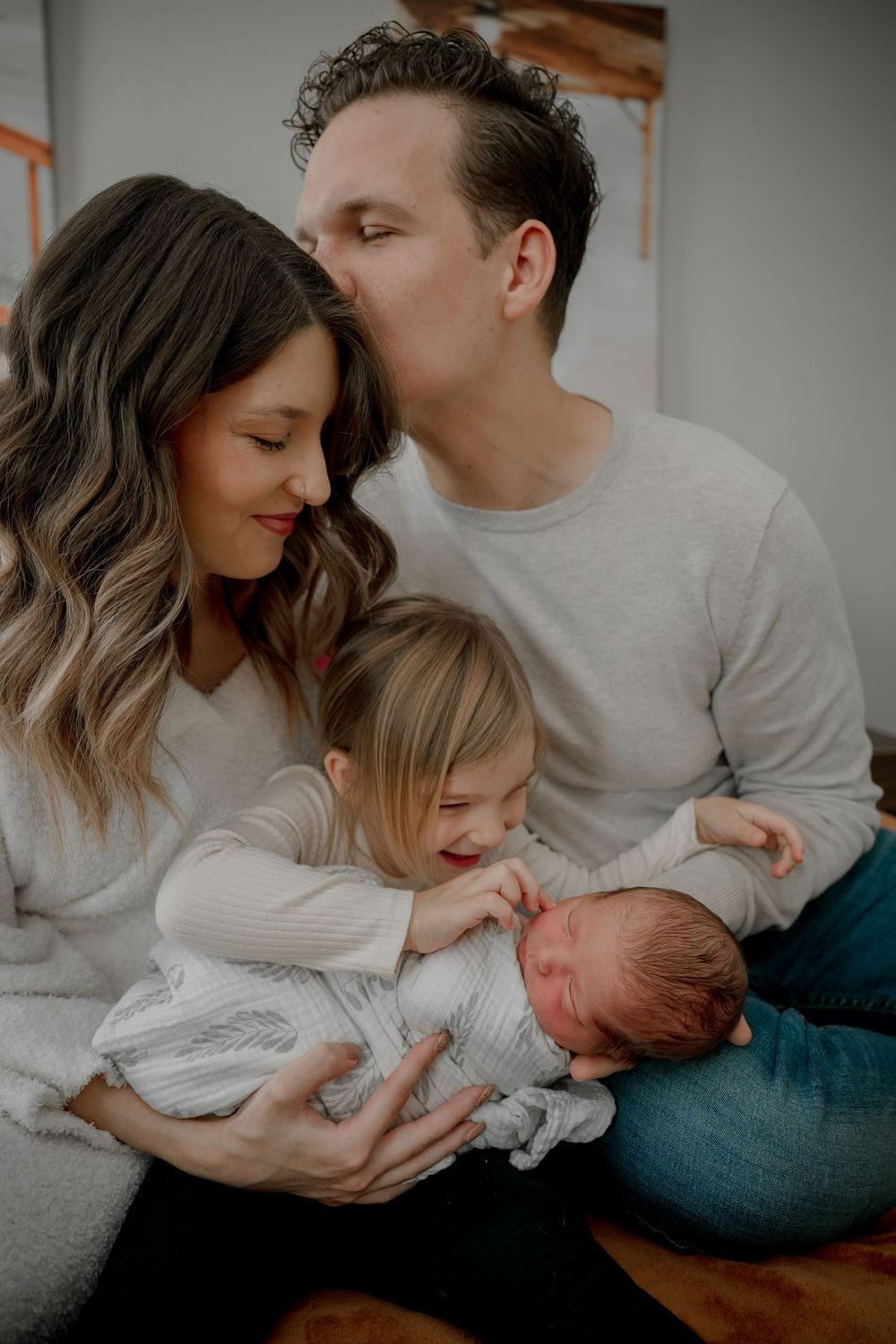 Candid lifestyle newborn portraits in DFW featuring parents and baby