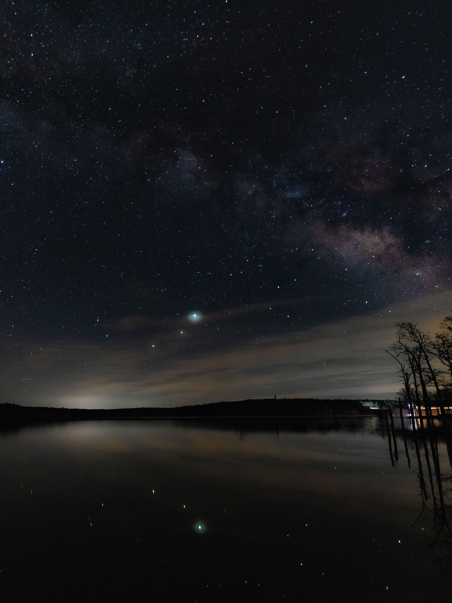 Mars, Saturn, and Jupiter align under the MilkyWay and reflect in the calm waters of McGee Creek State Park, OK