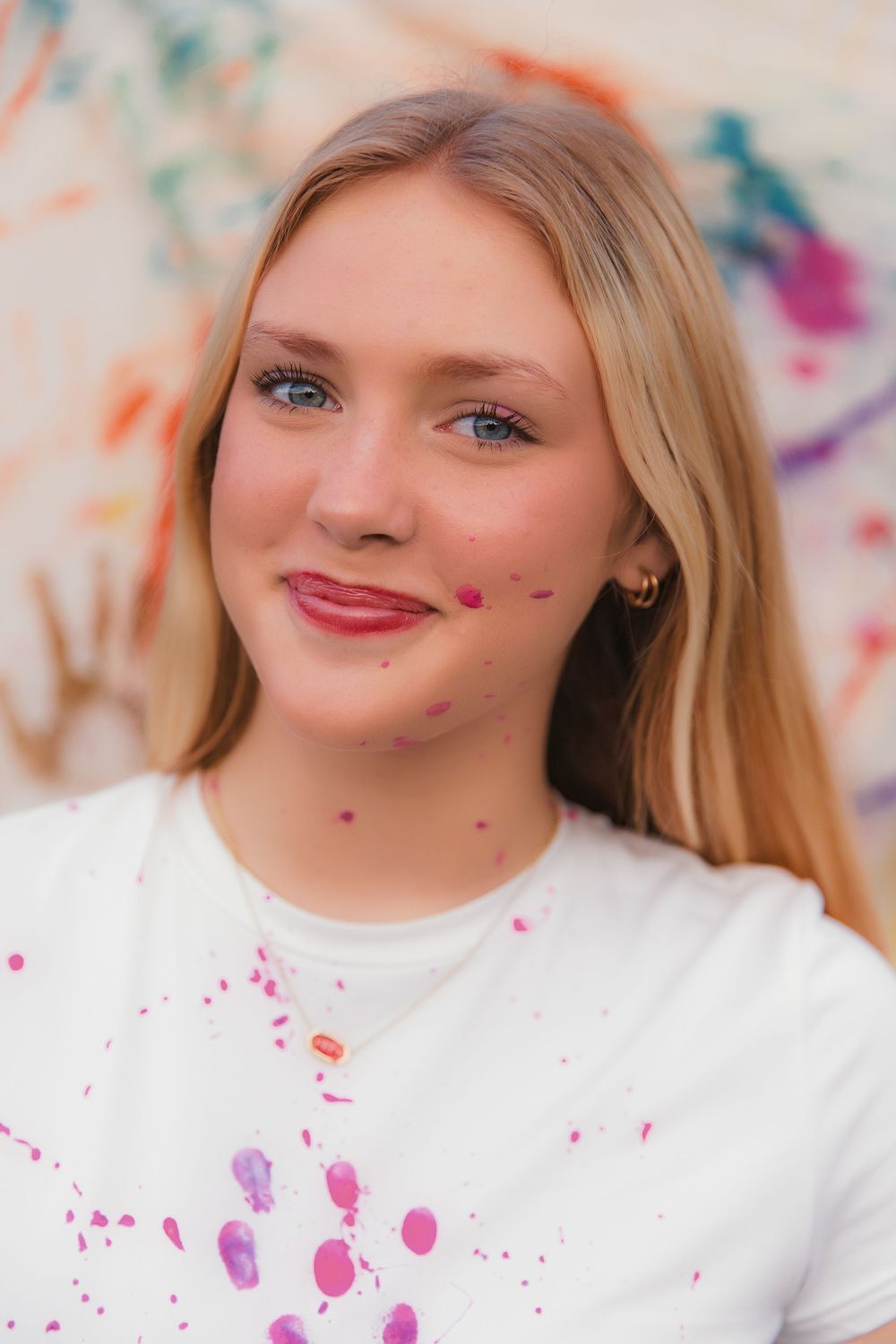 A sequence of close-up shots showing colorful paint splatters against a white background.