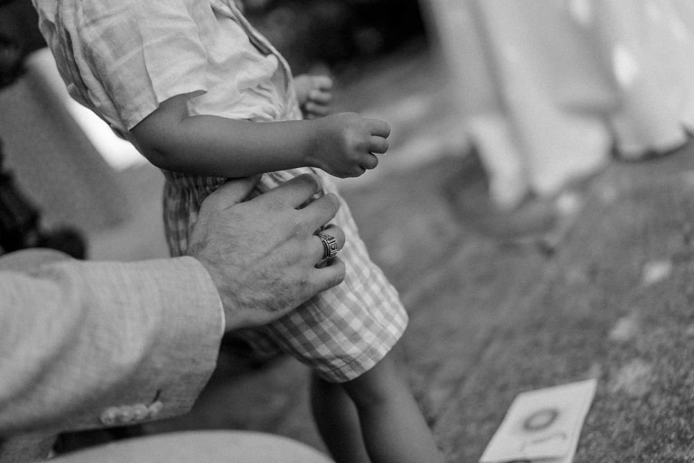 intimate moment groom holding baby wedding porto