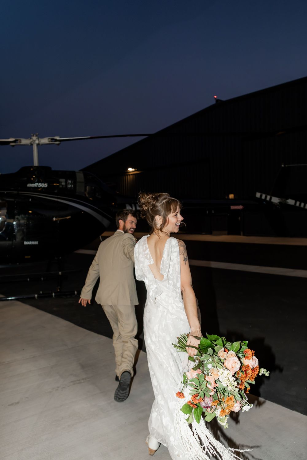 Bride and groom walking together after an intimate elopement in Utah