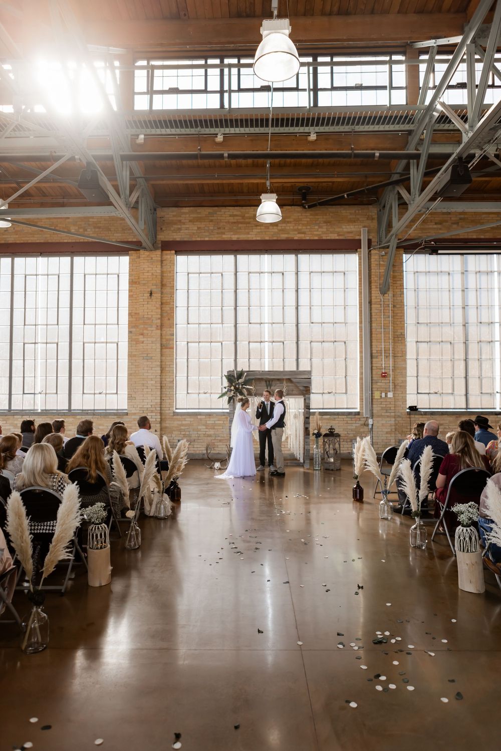 Indoor wedding ceremony photographed at a Wyoming wedding venue