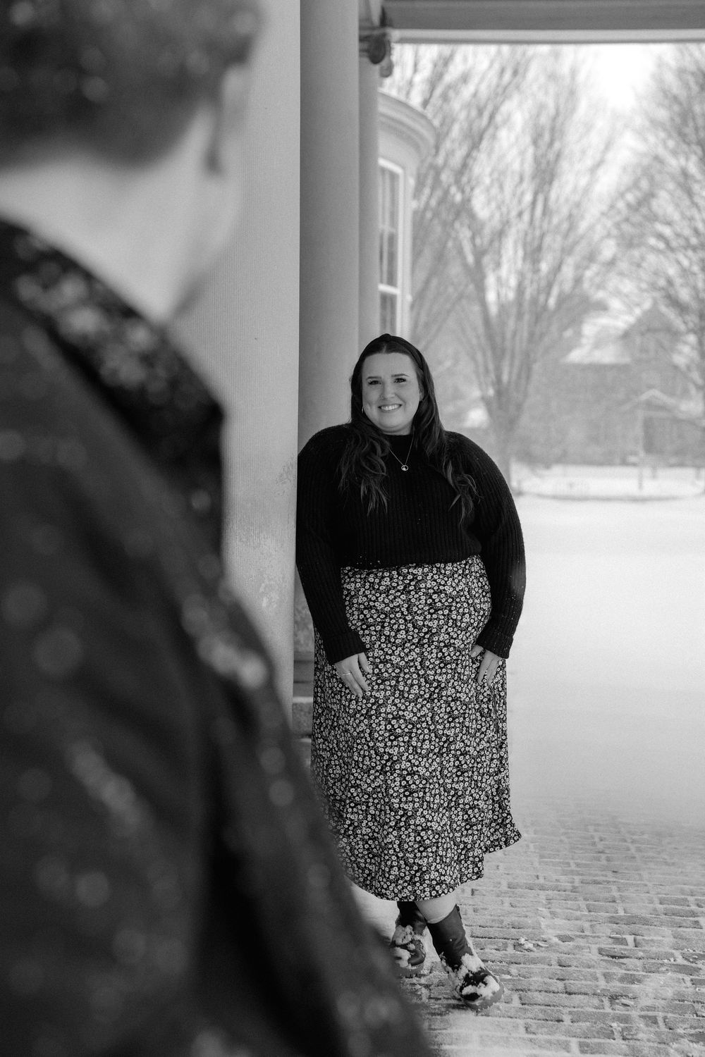 A guy admiring his bride to be at an engagement session at the Eastman Museum in Rochester.