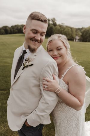 Wedding couple shares intimate moments in a series of candid outdoor photos.