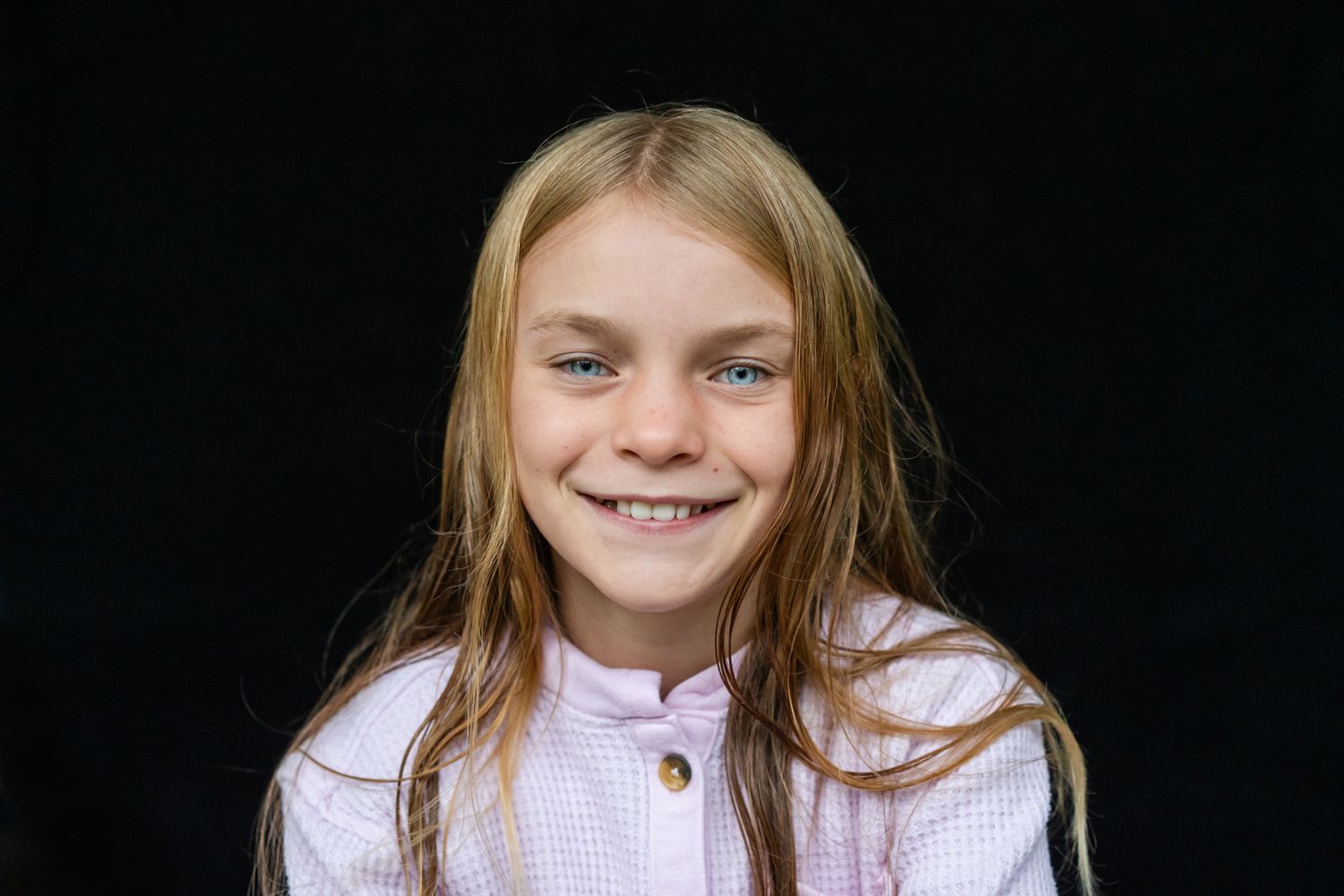 Personality school portrait of a young girl with blonde hair and blue eyes
