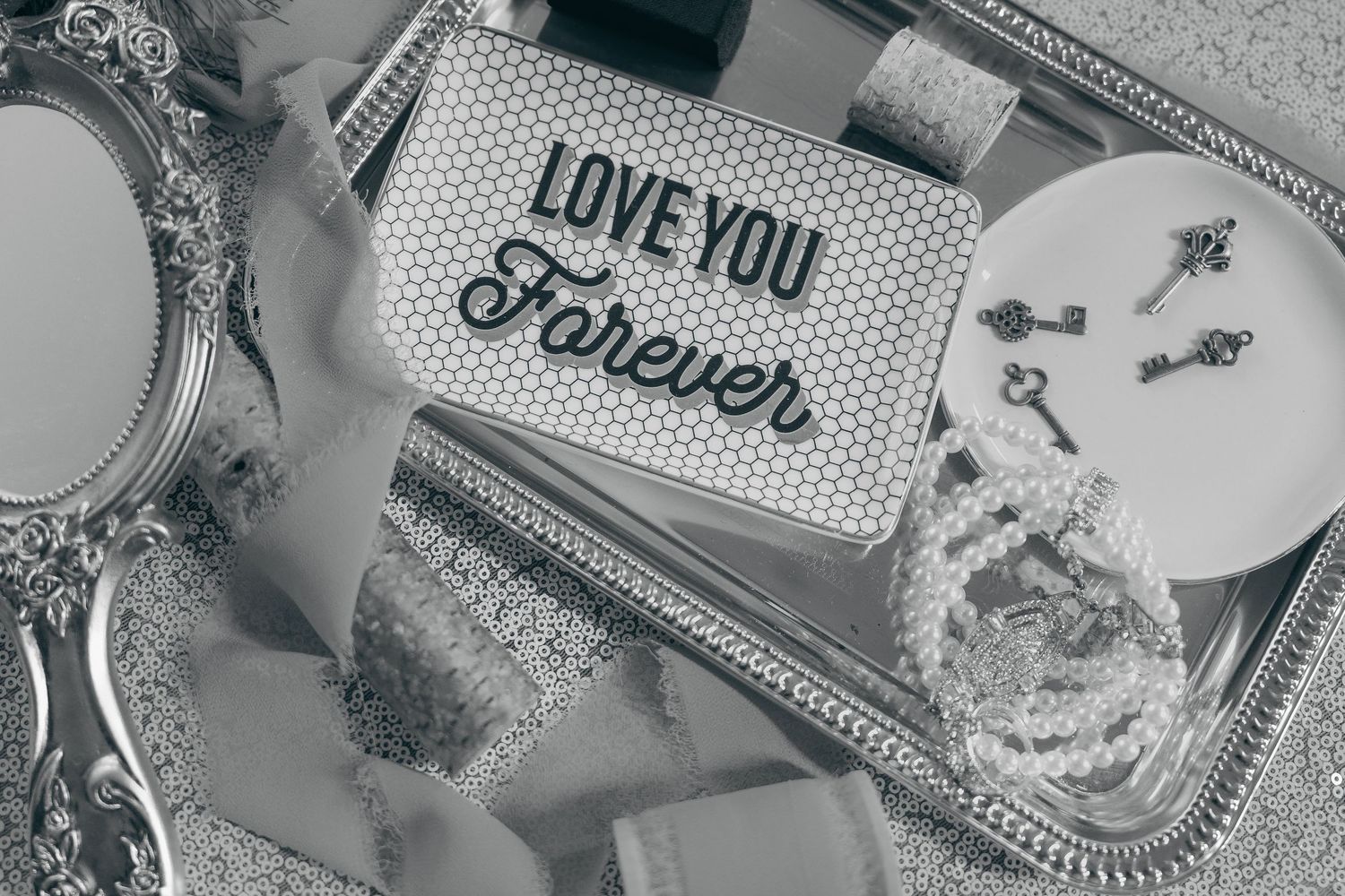 Black and white collage of romantic messages, love notes, and handwritten text on paper scraps and decorative backgrounds.