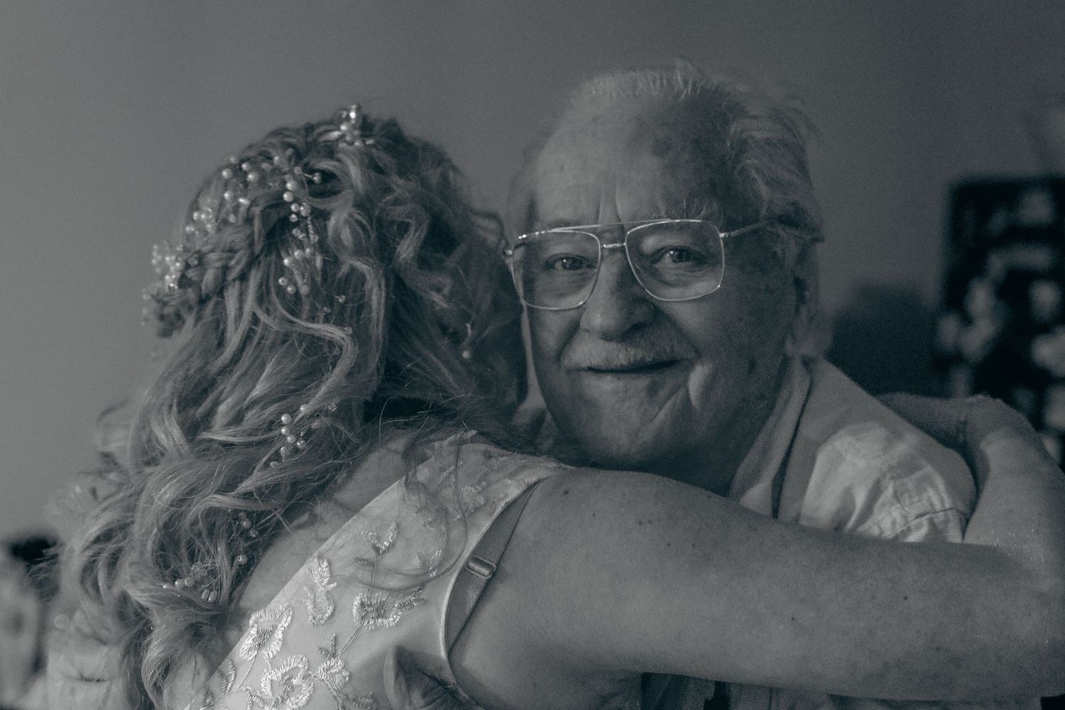 A black and white collage of candid moments showing elderly people expressing joy and laughter.