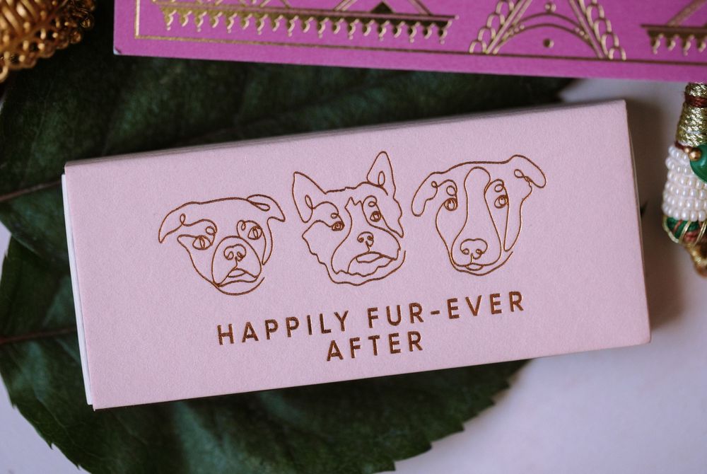 Pink decorative text displays 'HAPPILY FUR-EVER AFTER' with dog face illustrations in a romantic design style.