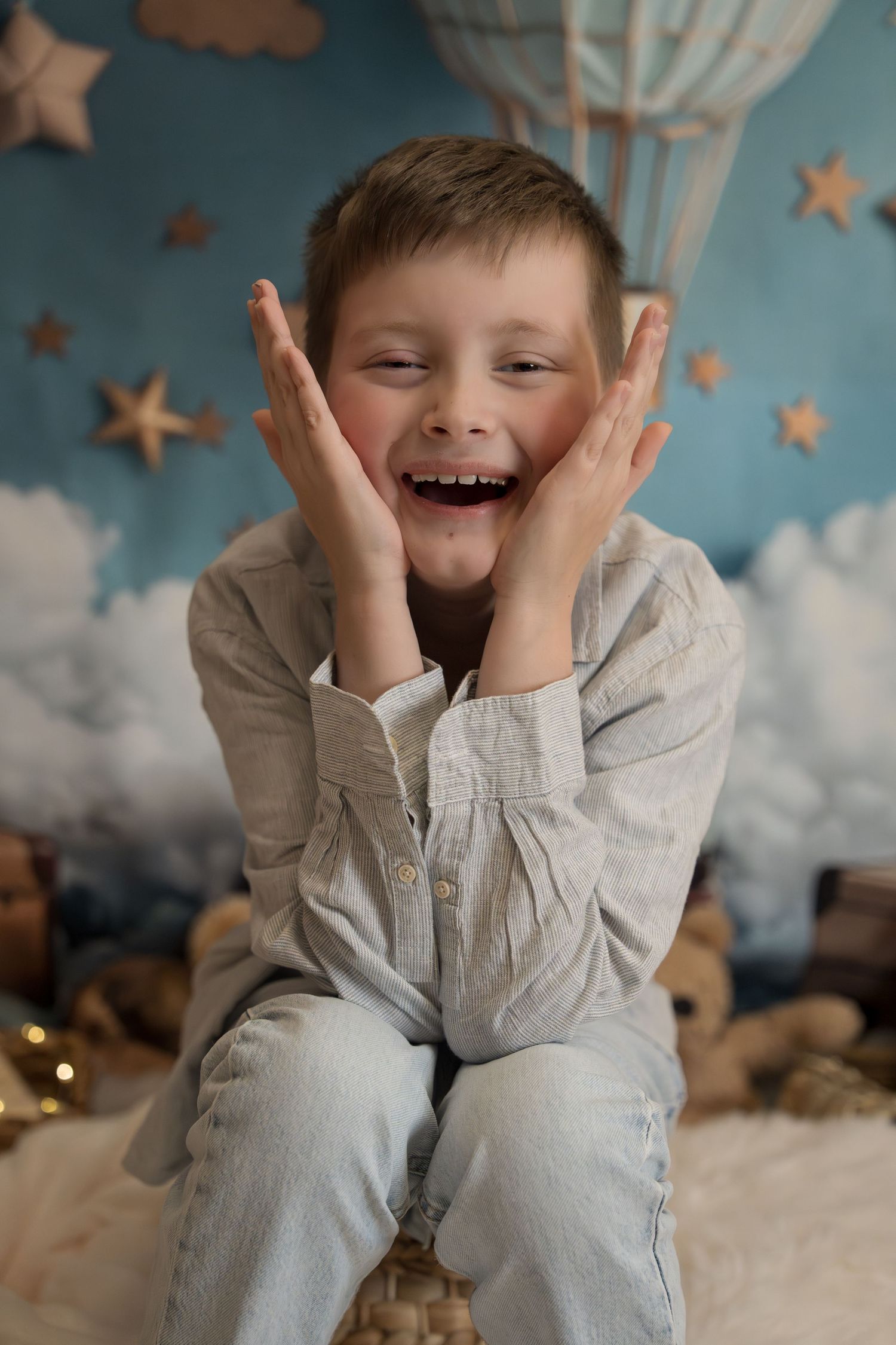 Joyful scene against blue backdrop with stars and clouds.