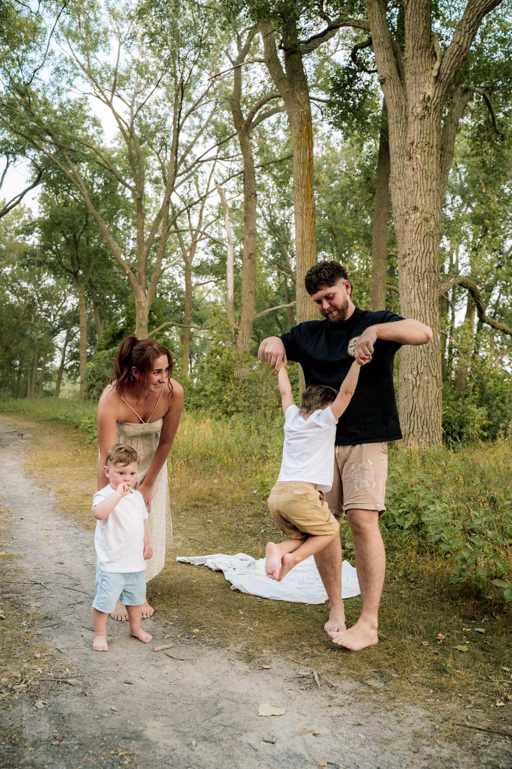 A series of candid moments captured along a tree-lined path showing playful interactions and movement.