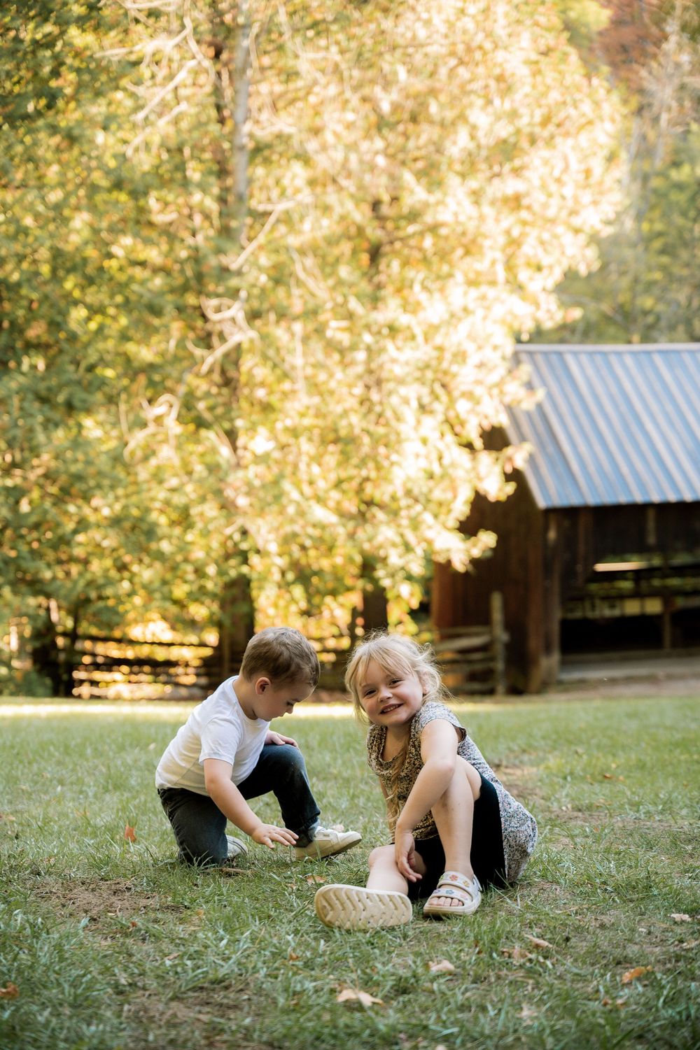 A playful scene of someone rolling and tumbling in the grass on a sunny day.