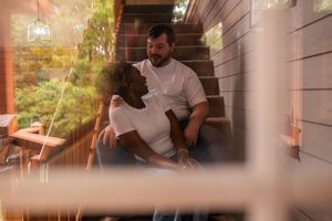 A series of intimate moments showing a couple embracing and sharing tender moments in a warmly lit indoor setting.
