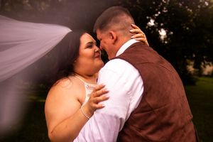 A romantic wedding couple shares intimate kisses in a series of outdoor portraits at sunset.