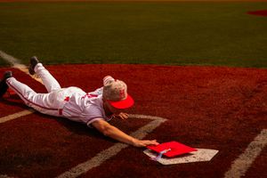 A sequence of baseball field action shots showing sliding plays and fielding attempts at home plate during a game.