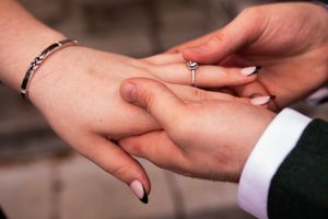 Close-up photo series showing an engagement ring being placed on a bride's finger during a wedding ceremony.