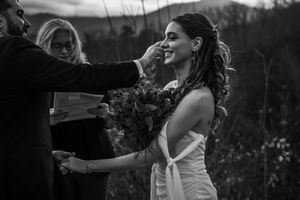 Black and white photo series showing joyful moments between a couple during an intimate outdoor wedding celebration.