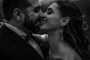 A series of black and white romantic photographs showing couples embracing and kissing in intimate moments.