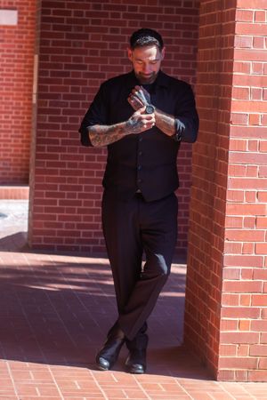 Wedding photography sequence showing artistic poses against red brick architecture.