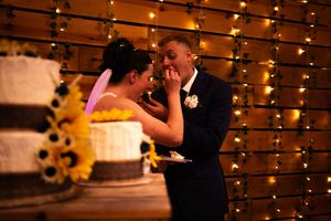 String lights create a romantic backdrop at an evening wedding reception.
