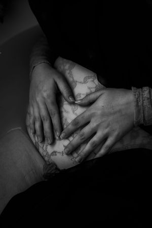Black and white close-up sequence showing hands kneading and shaping clay in artistic detail.