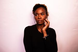 A dramatic fashion portrait series showing poses against a soft pink backdrop.