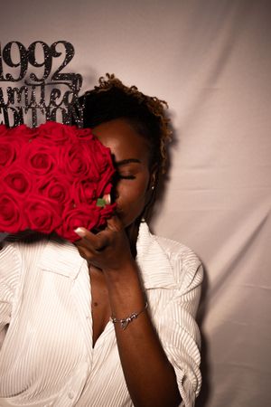 A series of artistic portraits showing someone in a white shirt holding red roses against a neutral background.