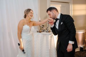 Candid wedding moments captured in an elegant indoor setting with soft lighting.