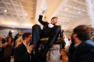 A series of dance floor photos showing people celebrating at a wedding reception in an indoor venue with white ceilings.