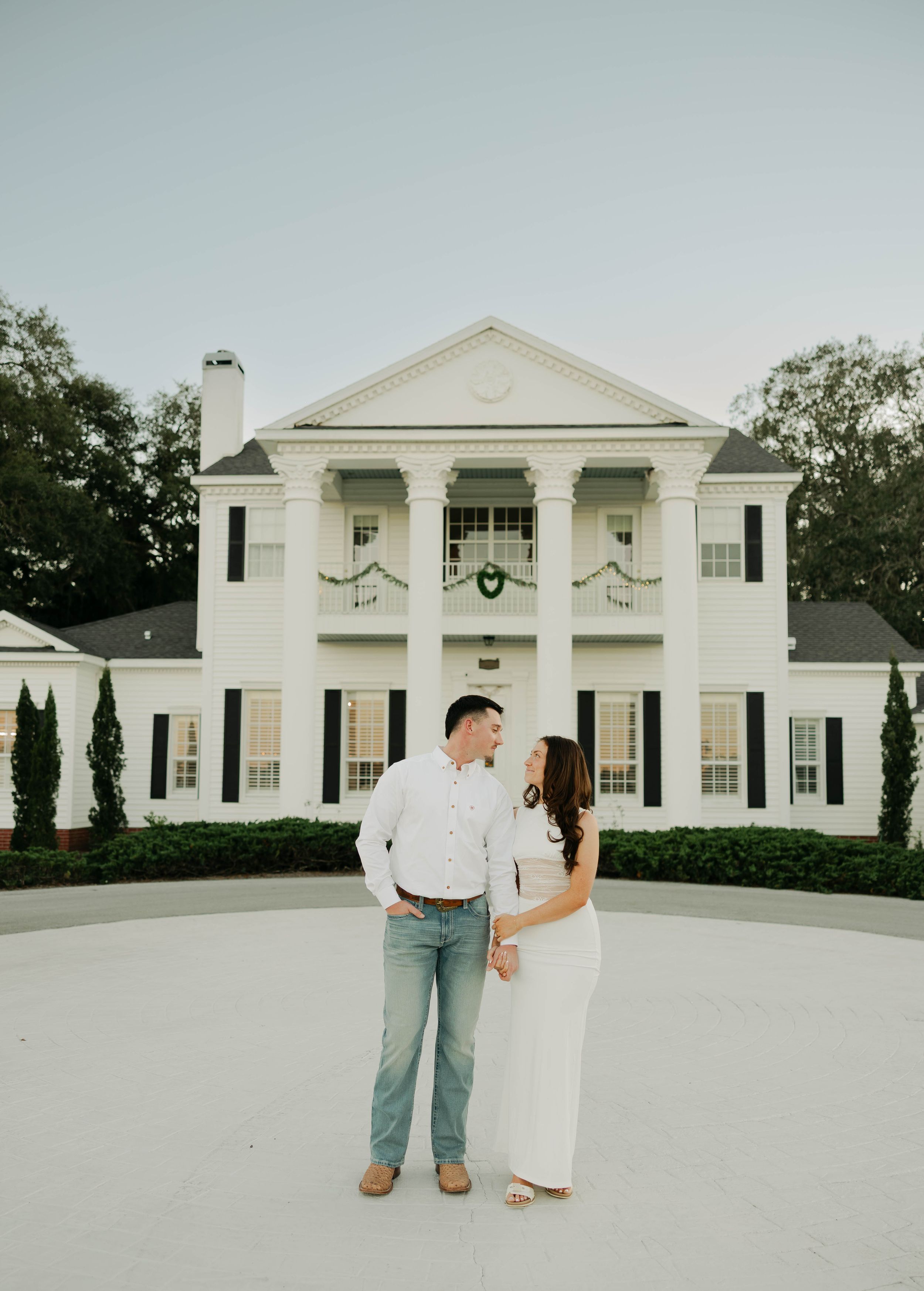 A white colonial-style mansion with columns photographed from different angles against a cloudy sky.