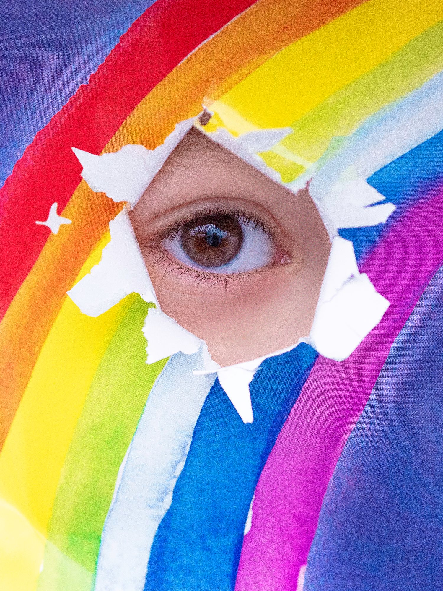 Colorful rainbow face paint design with white stars against blue background.