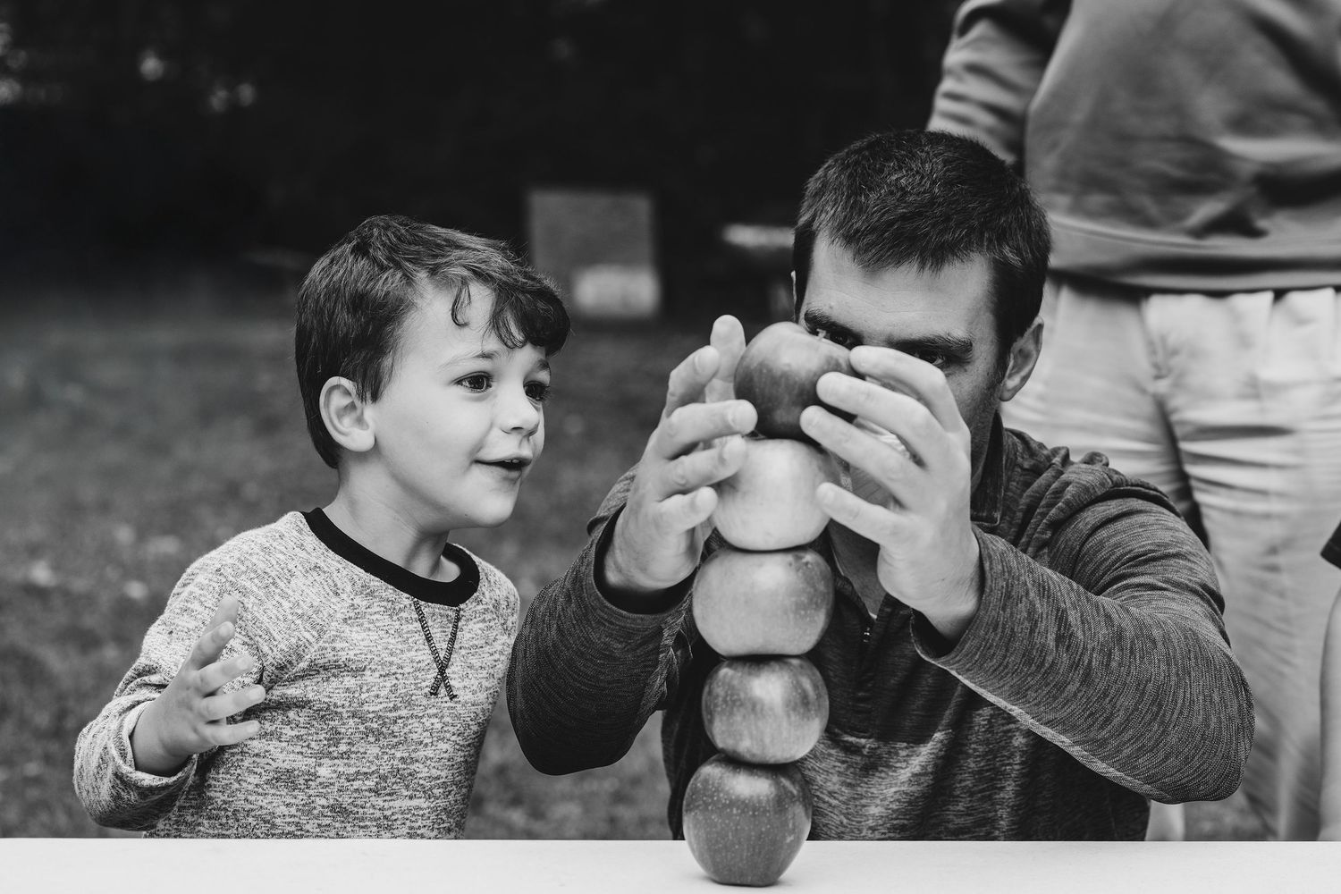 A sequence of images showing hands holding and examining objects in natural light.