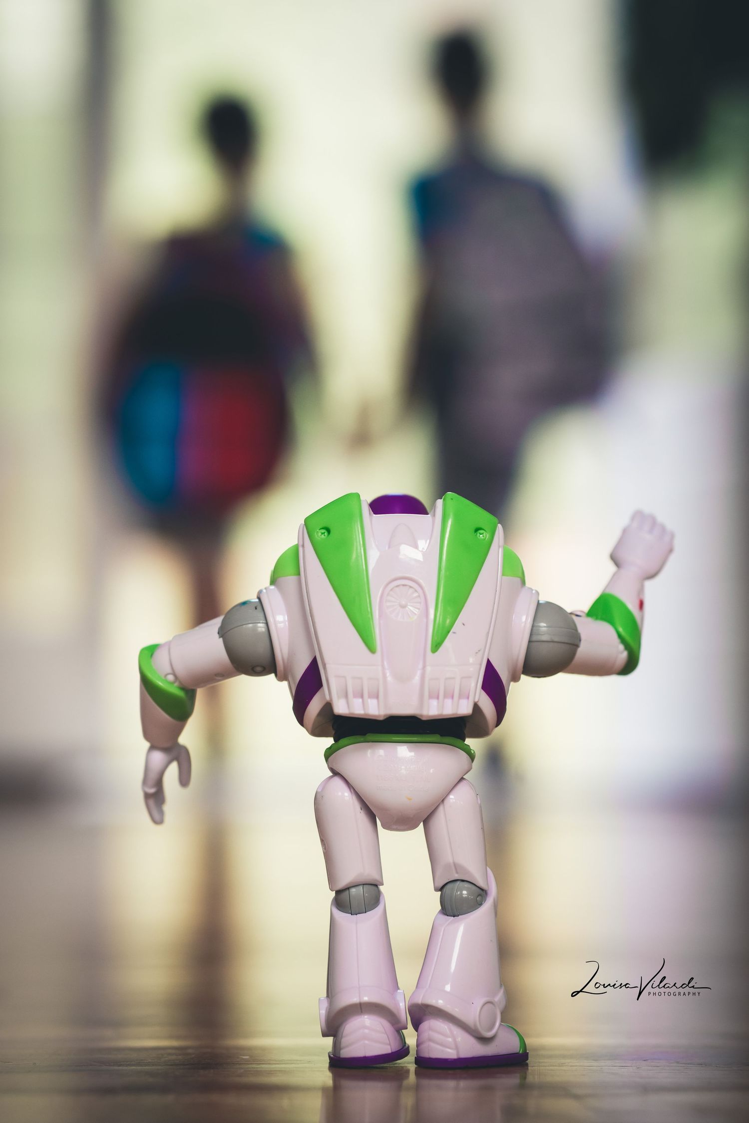 A series of photos showing a Buzz Lightyear toy figure from different angles on a reflective surface.