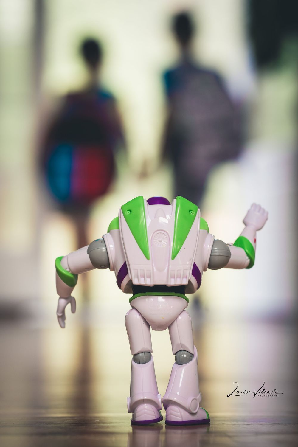 A series of photos showing a Buzz Lightyear toy figure from different angles on a reflective surface.