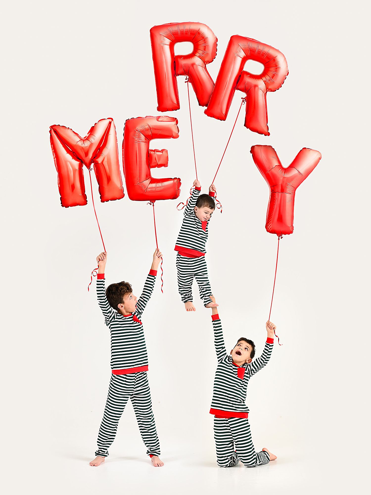 Red letter balloons spell out text against white background held by figures in striped outfits.