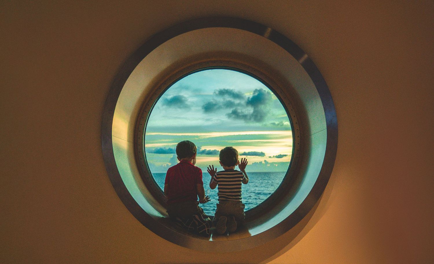 Progressive shots through a cruise ship porthole window showing ocean views at sunset.