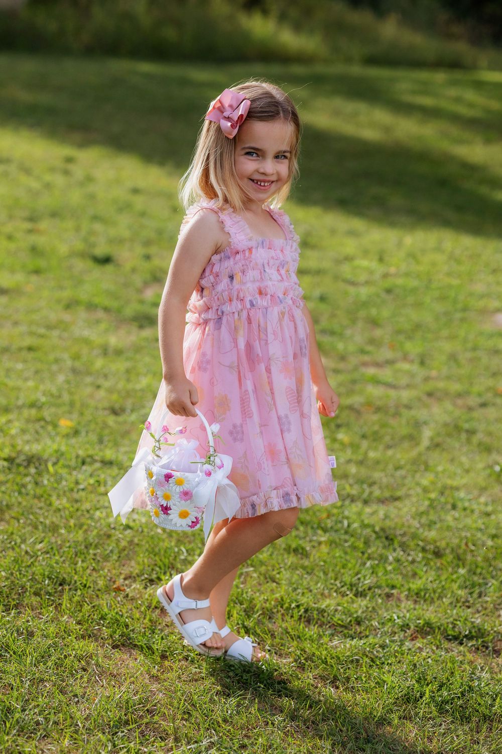 Flower girl with her basket arriving at the ceremony