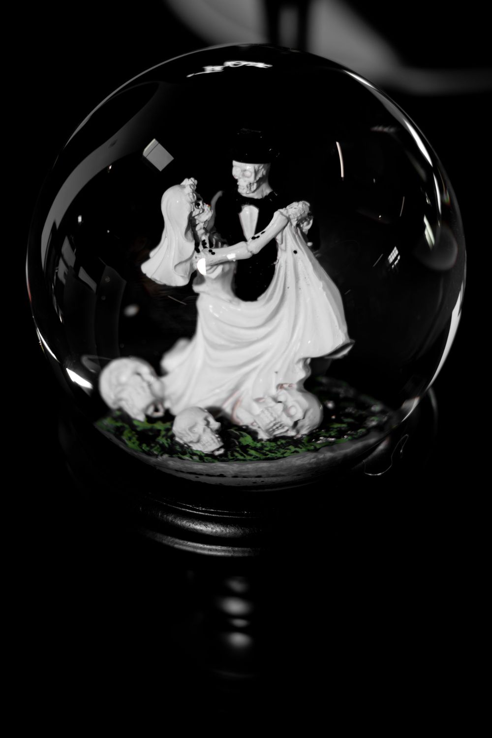 Black and white photo series of white meringue desserts arranged in glass bowls on a dark surface.