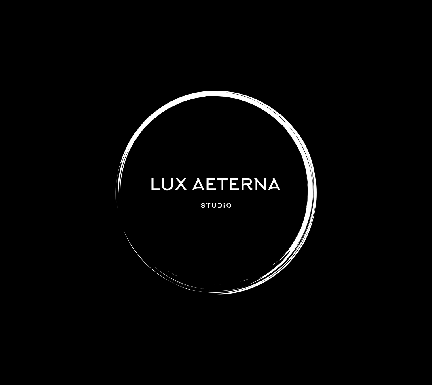 Lux Aeterna Studio logo with white circular brushstroke design on black background.