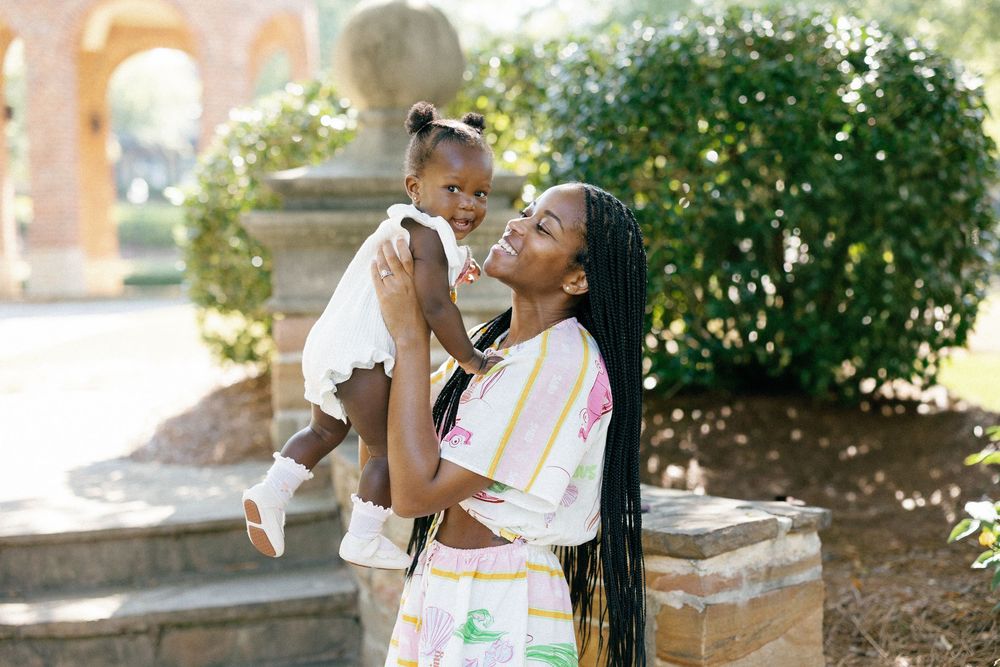 A series of candid photos showing a tender moment between a parent and child in a sunlit outdoor setting.