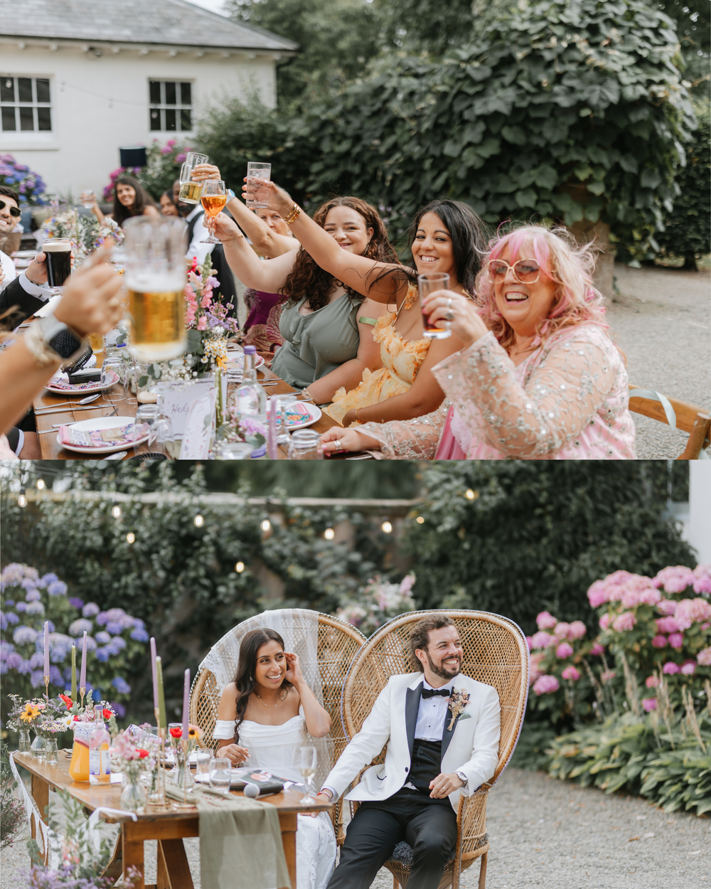 Wedding guests raise glasses in a toast at an outdoor garden reception while couple sits at decorated table with flowers.