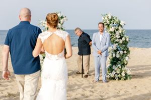 Groom seeing his bride walking down the aisle.