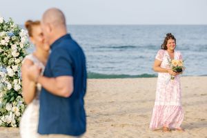 father and daughter dance while Mother is touched by the beauty of the moment.